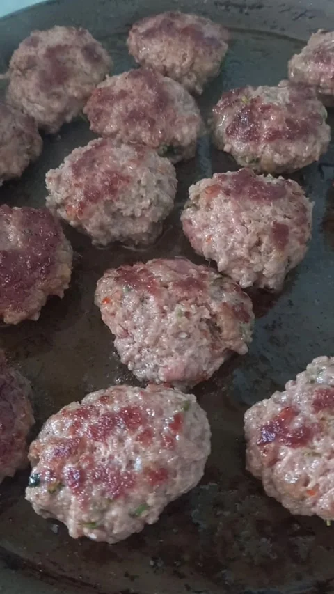 Cooking meatballs on a grill Stock Footage 274830908