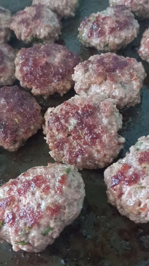 Cooking meatballs on a grill Stock Footage 274832031