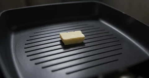 Cooking Melted yellow butter in a hot pan, Barbecue cooking food concept. Stock Footage