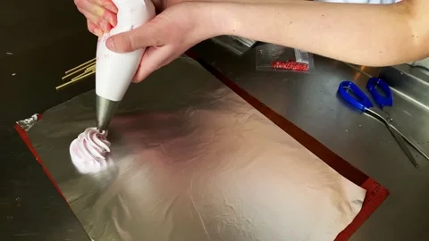 Cooking meringue on a stick, the process of making sweets from egg white Stock Footage 150495455