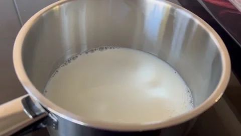 Cooking Milk For Breakfast Stock Footage 221261239