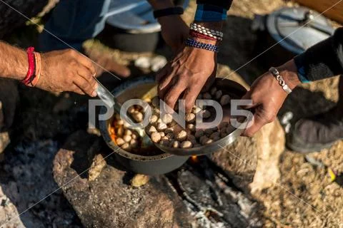 Cooking mix veg using firewood is an survival skill needed when going to the Stock Photos