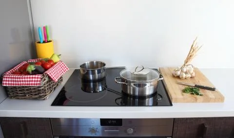 Cooking in modern kitchen Stock Photos