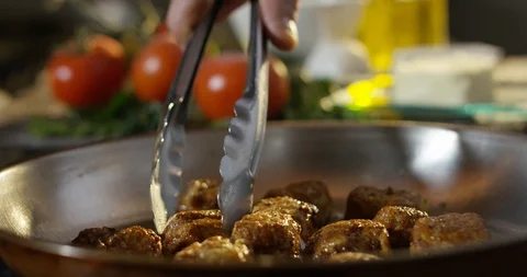 Cooking morsels of meat 4k Stock Footage 85835978