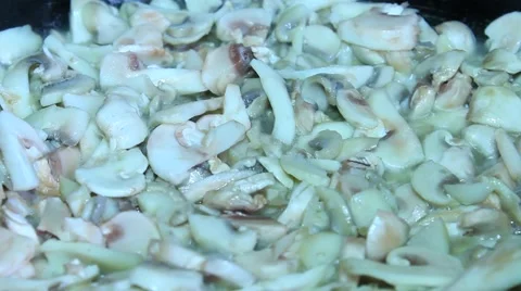 Cooking mushrooms in a pan Stock Footage 61453691