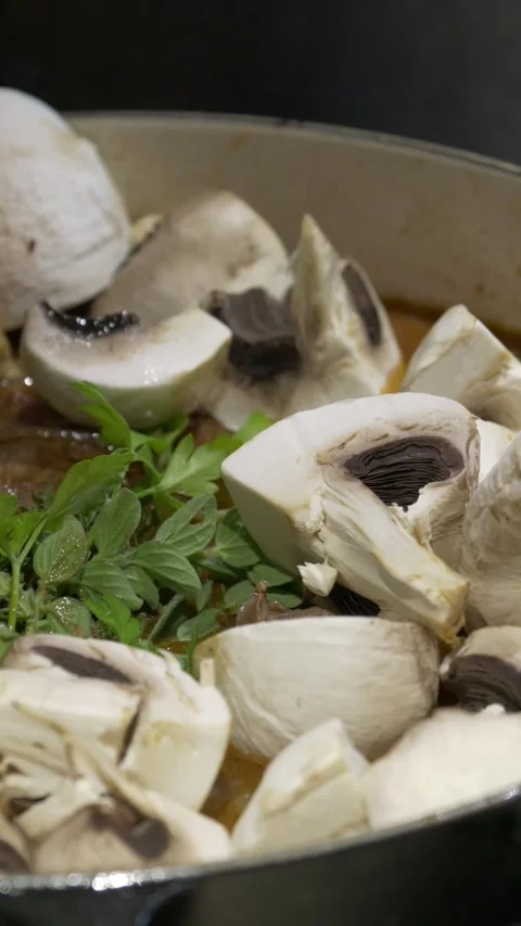 Cooking with mushrooms vertical Stockbeeldmateriaal 318106473