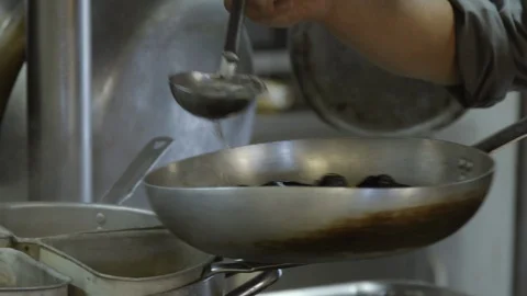 Cooking mussels in a pan Stock Footage 86203413
