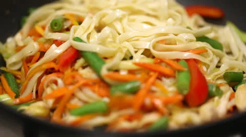 Cooking noodles with vegetables Stock Footage 24528352