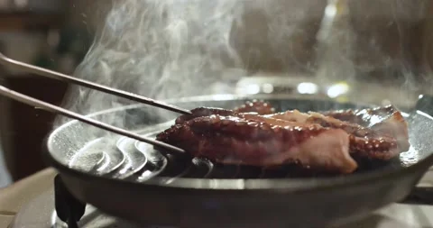 Cooking octopus burning charcoals fire on barbecue grid, Stock-Footage 154849579