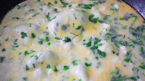 Cooking omelet in the pan, egg with cheese and spices Video stock 142164197