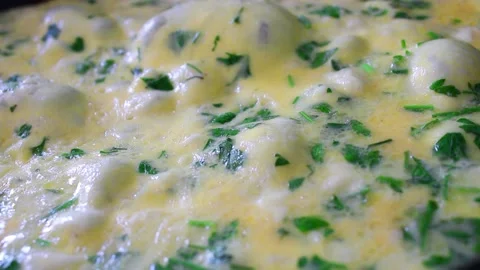 Cooking omelet in the pan, egg with cheese and spices Stock Footage 142164545
