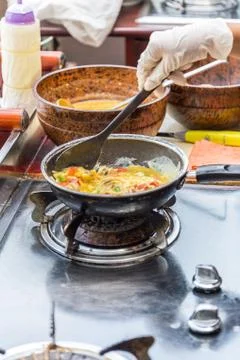 Cooking Omelet in Pan Stock Photos