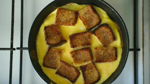 Cooking an omelette with fried bread croutons Stock Footage 337830703