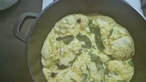 Cooking an omelette in a frying pan. Stock Footage 236452535
