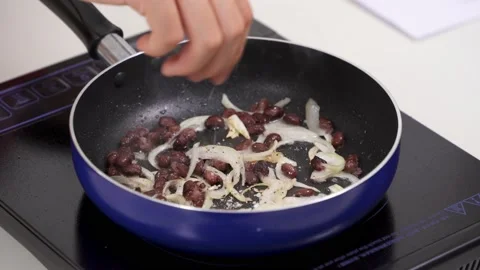 Cooking onion on a pan Stock Footage 146072546