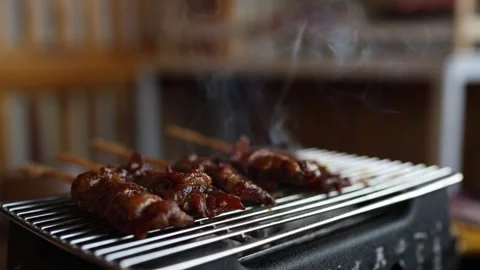 Cooking outdoor as we camp on a mountain surrounded by abundant nature Stock Footage 342229809
