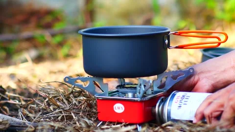 Cooking outdoors with camping tools Stock Footage 240527285