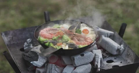Cooking over campfire Stock Footage 163000983