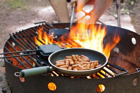 Cooking over campfire Stock Photos
