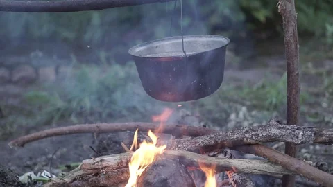 Cooking over a fire in nature Stock Footage 71274455