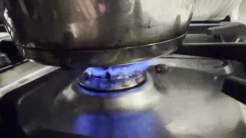 Cooking over a gas flame Stock Footage 325437319