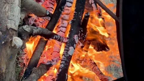 Cooking Over Open Fire in a Large Cauldron with Smoke and Flames. Stock Footage 296670162