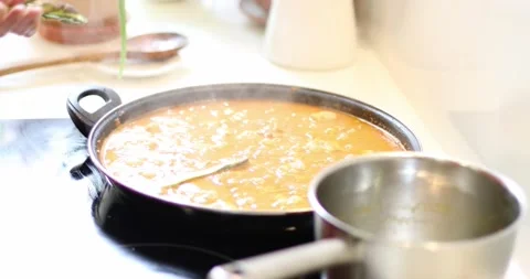 Cooking paella adding asparagus Stock Footage 160077790