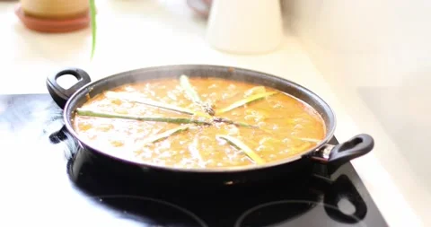 Cooking paella boiling Stock Footage 160077815