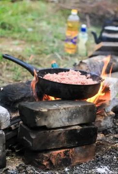 Cooking in a pan on camp Stock Photos