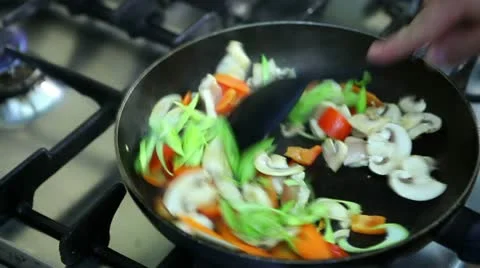 Cooking in a pan Stock Footage 24672046