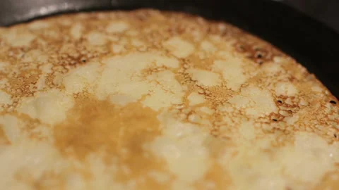 Cooking pancake on induction frying pan, close up. Stock Footage 166144901