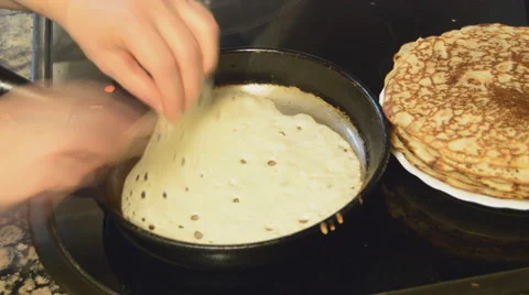 Cooking Pancakes and Stacking them on a Plate Stock Footage 47597726