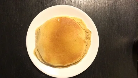 Cooking pancakes for breakfast Stock Footage 86715820