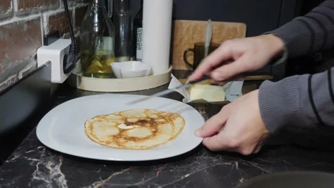 Cooking pancakes for Breakfast in the kitchen Video stock 143967806