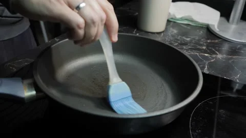 Cooking pancakes for Breakfast in the kitchen Video stock 143972380