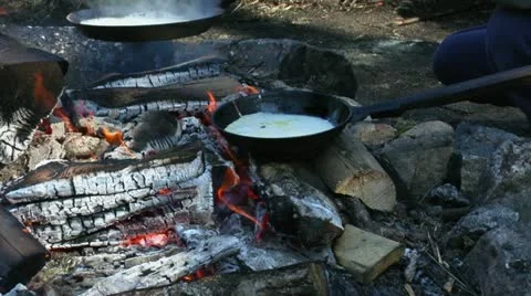 Cooking pancakes on a fire 1 Stock Footage 11394674