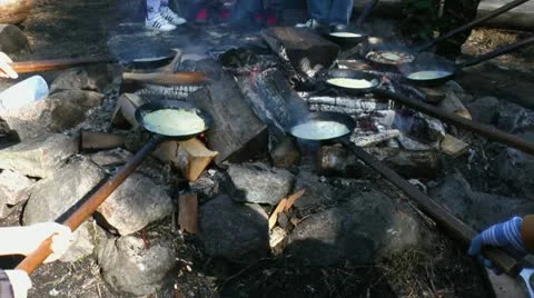 Cooking pancakes on a fire 3 Stock Footage 11394673