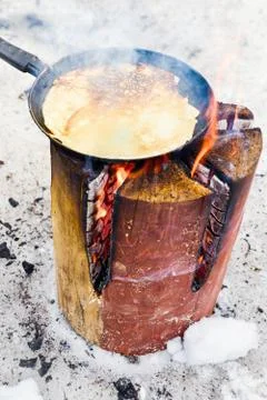 Cooking pancakes on fire Stock Photos
