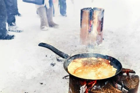 Cooking pancakes on fire Stock Photos