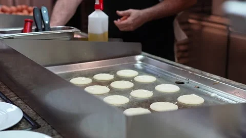 Cooking Pancakes on Flat Top Griddle in Restaurant Kitchen Stock Footage 346092992
