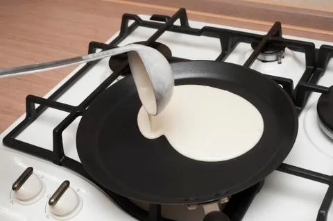 Cooking pancakes Stock Photos