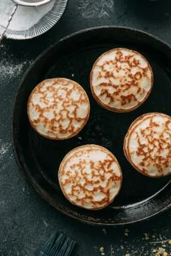 Cooking pancakes Stock Photos