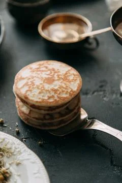 Cooking pancakes Stock Photos