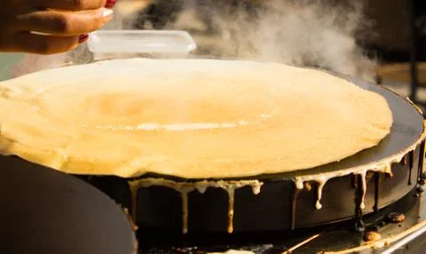 Cooking pancakes Stock Photos