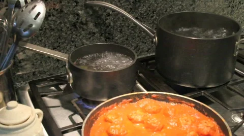Cooking Pasta and Meatballs Stock Footage