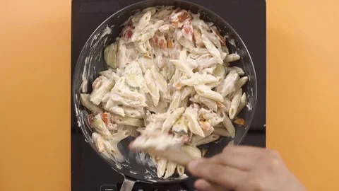 Cooking Pasta With White Sauce Table Top Stock Footage 76994820