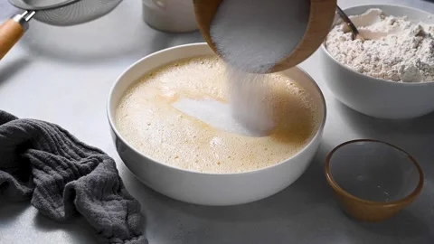 Cooking pastry dessert. Adding sugar to egg mixture, baking process. Stock Footage 260315324