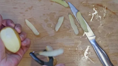 Cooking: Peeling a potato Video stock 278348344