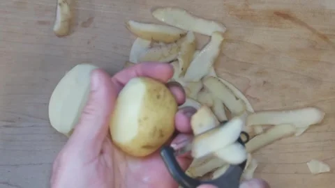 Cooking: Peeling potatoes Stock Footage 278348252