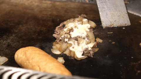 Cooking Philly beef cheese steak on hot plate Stock Footage